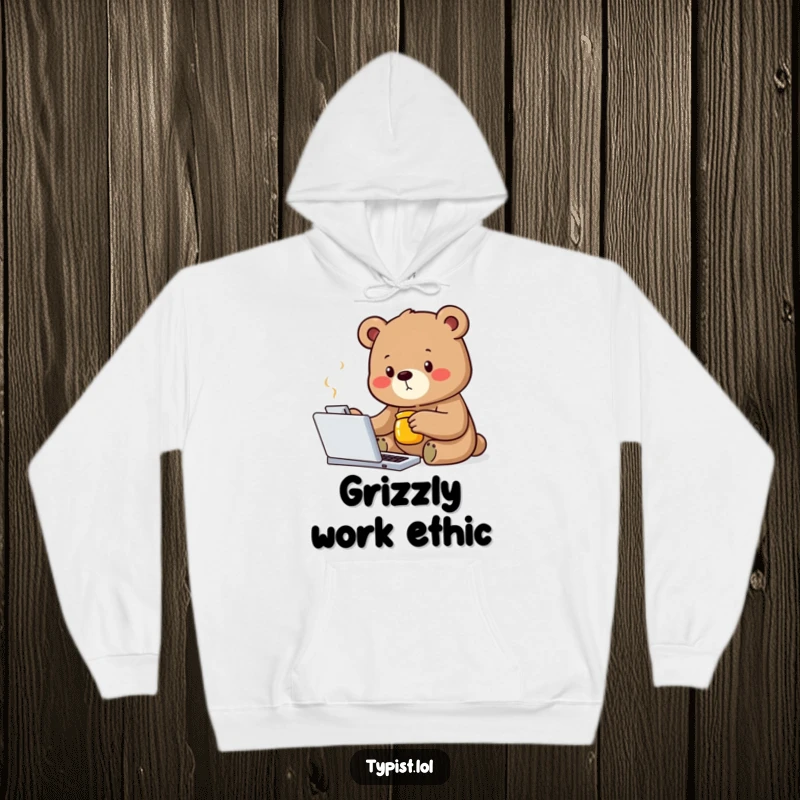 Funny bear hoodie depicting a determined bear typing with one paw while holding a honey jar, embodying focus and reward.