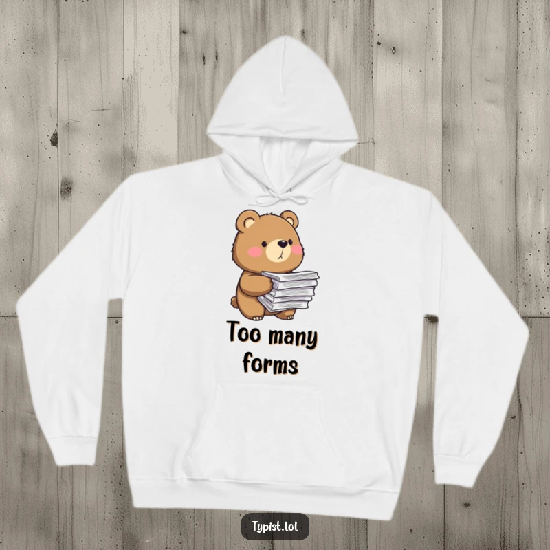 Funny hoodie graphic of a composed bear balancing a precarious stack of papers, conveying determination and workload humor.