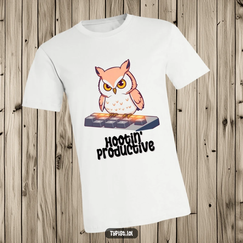 Funny T-Shirt depicting a determined owl intensely pecking at illuminated keyboard keys, perfect for those who focus on their work.