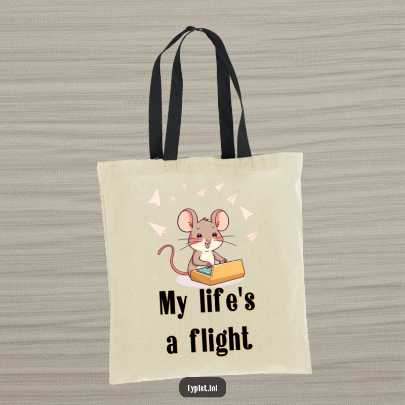 Funny brave mouse typing amidst paper airplanes, humorous tote bag, practical and inspirational design, carry-all.