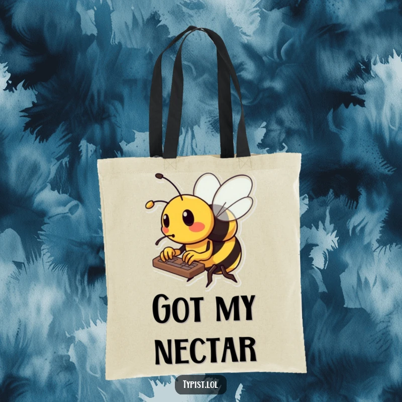 Funny bee tote bag depicting a busy bee typing rapidly on a keyboard with its tiny stinger, hard at work.